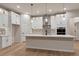 Bright and modern kitchen with a large center island and stainless steel appliances at 461 Muirfield Cir, Louisville, CO 80027