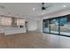 Bright, open-concept living space with hardwood floors and a modern kitchen and fireplace at 461 Muirfield Cir, Louisville, CO 80027