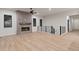 Bright living room with a sleek fireplace and staircase access at 461 Muirfield Cir, Louisville, CO 80027