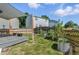 Fenced backyard featuring a deck, lawn, and planters at 11898 W Tufts Pl, Morrison, CO 80465