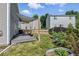 Fenced backyard with grass and deck featuring a sun shade at 11898 W Tufts Pl, Morrison, CO 80465
