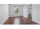 Bright bedroom featuring a window with leafy views and wood-look floors at 11898 W Tufts Pl, Morrison, CO 80465