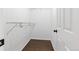 Walk in closet with custom shelving and room for storage at 11898 W Tufts Pl, Morrison, CO 80465
