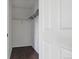 Walk in closet with custom shelving and dark, hard wood floors at 11898 W Tufts Pl, Morrison, CO 80465