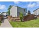 Charming two-story home featuring light gray siding and a fenced yard at 11898 W Tufts Pl, Morrison, CO 80465
