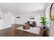 Open concept of living room, showcasing the modern decor, light-filled space, and hardwood floors at 11898 W Tufts Pl, Morrison, CO 80465