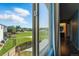 Picture window showing a beautiful view of a manicured lawn and surrounding neighborhood at 11898 W Tufts Pl, Morrison, CO 80465