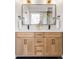 Elegant bathroom featuring double sinks, vanity, and contemporary lighting fixtures at 1757 W 36Th Ave, Denver, CO 80211