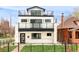 Modern home with multi-level balconies, fenced yard, and large windows at 1757 W 36Th Ave, Denver, CO 80211