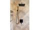 Modern shower featuring black fixtures and stylish, patterned tile at 1757 W 36Th Ave, Denver, CO 80211