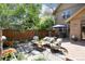 Outdoor patio showcasing comfortable seating and a built-in grill, perfect for entertaining at 2042 S Clayton St, Denver, CO 80210