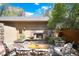 Inviting patio area with a cozy stone fireplace and comfortable seating at 2042 S Clayton St, Denver, CO 80210