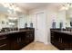 Bathroom with double vanity, granite counters, tile floors, and neutral paint at 2042 S Clayton St, Denver, CO 80210