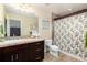 Bathroom with walk-in shower and vanity with dark wood cabinets at 2042 S Clayton St, Denver, CO 80210