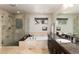 Luxurious bathroom with glass-enclosed shower, soaking tub, and granite vanity at 2042 S Clayton St, Denver, CO 80210