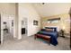 Bedroom featuring vaulted ceiling, carpet floors, and en-suite bathroom at 2042 S Clayton St, Denver, CO 80210