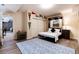 Bedroom features closet, murphy bed, plank floors, and colorful sports pennants at 2042 S Clayton St, Denver, CO 80210