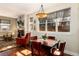 Cozy living room with fireplace, dining table, and large windows for natural light at 2042 S Clayton St, Denver, CO 80210