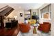 Stylish living room with hardwood floors, comfortable seating and staircase at 2042 S Clayton St, Denver, CO 80210