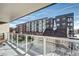 Balcony view of nearby apartment buildings with balconies and a beautiful historic church steeple at 4200 W 17Th Ave # 235, Denver, CO 80204
