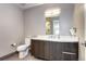 Contemporary bathroom features a sleek vanity with modern fixtures and a toilet with clean lines at 4200 W 17Th Ave # 235, Denver, CO 80204