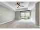 Spacious main bedroom with carpeted floors, ceiling fan and large windows at 4200 W 17Th Ave # 235, Denver, CO 80204