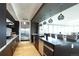 Modern kitchen with stainless steel appliances, dark cabinetry, and stylish pendant lighting at 4200 W 17Th Ave # 235, Denver, CO 80204