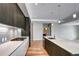 Contemporary kitchen features a center island, stainless steel appliances, and modern finishes for stylish cooking at 4200 W 17Th Ave # 235, Denver, CO 80204