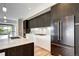 Sleek kitchen with a spacious island, stainless steel appliances, and ample counter space for culinary enthusiasts at 4200 W 17Th Ave # 235, Denver, CO 80204
