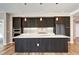 Modern kitchen boasts an island, sleek cabinetry, stainless appliances, and ample counter space for cooking needs at 4200 W 17Th Ave # 235, Denver, CO 80204