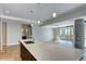 Modern kitchen with stone countertops, dark cabinets, and stainless steel sink at 4200 W 17Th Ave # 235, Denver, CO 80204