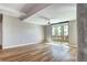 Bright living room with hardwood floors, modern fan and large windows offering outside views at 4200 W 17Th Ave # 235, Denver, CO 80204