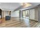 Open living space with hardwood floors, kitchen island, and natural light at 4200 W 17Th Ave # 235, Denver, CO 80204