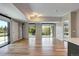 Open-concept living area with natural light, hardwood floors, and concrete pillar; seamlessly blends modern living at 4200 W 17Th Ave # 235, Denver, CO 80204