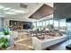 Large resident lounge with modern decor, comfortable seating, and expansive windows offering scenic views at 4200 W 17Th Ave # 235, Denver, CO 80204