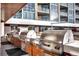 Well-equipped outdoor kitchen featuring built-in stainless steel grills, perfect for entertaining guests at 4200 W 17Th Ave # 235, Denver, CO 80204