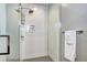 The frameless glass shower is tiled and features a modern shower head and built-in storage niche at 4200 W 17Th Ave # 235, Denver, CO 80204