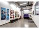 Large ski storage room featuring ski racks, a ping pong table, and modern artistic decor at 4200 W 17Th Ave # 235, Denver, CO 80204