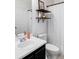 Bathroom with white tile, floating shelves, and updated vanity at 6013 Castlegate Dr # D33, Castle Rock, CO 80108