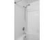 Clean bathroom with white tile and a shower/tub combo at 6013 Castlegate Dr # D33, Castle Rock, CO 80108