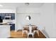 Charming dining area with wooden table and four metal chairs at 6013 Castlegate Dr # D33, Castle Rock, CO 80108