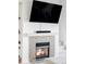 Modern fireplace with stone surround in living room at 6013 Castlegate Dr # D33, Castle Rock, CO 80108