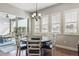 Bright dining area with glass-top table and access to a patio at 25852 E Clifton Pl, Aurora, CO 80016