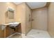 Accessible bathroom with tiled shower, grab bars, and granite sink at 256 King St, Denver, CO 80219