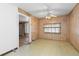 Cozy dining room featuring a ceiling fan and wood-paneled walls at 256 King St, Denver, CO 80219