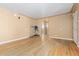 Bright living room featuring hardwood floors, a doorway, and neutral wall colors at 256 King St, Denver, CO 80219