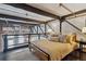 Loft bedroom featuring rustic modern bed, brick and pipes at 1111 Osage St # 29, Denver, CO 80204