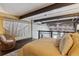 Cozy bedroom featuring a stylish chair, decor and stairway at 1111 Osage St # 29, Denver, CO 80204