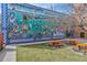 Exterior mural on building with picnic tables at 1111 Osage St # 29, Denver, CO 80204