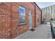 Brick exterior with front door access and a concrete walkway to the building at 1111 Osage St # 29, Denver, CO 80204